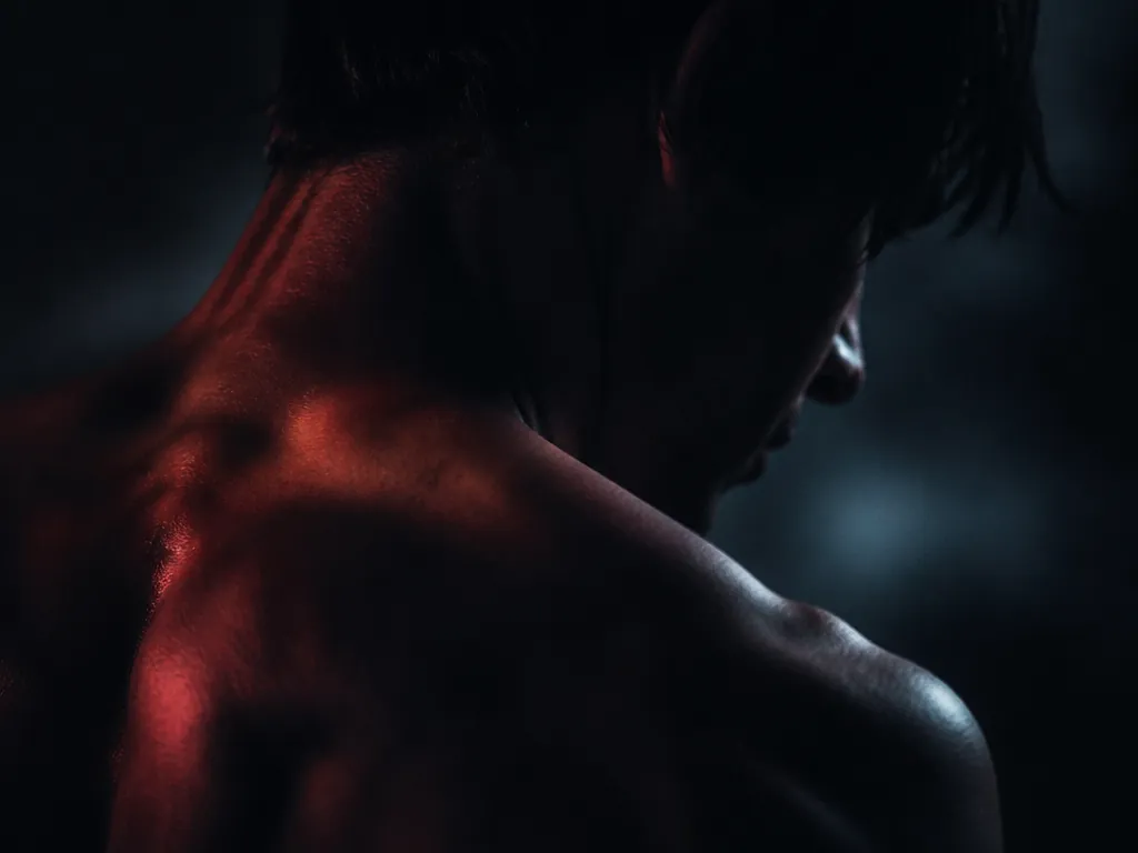 An abstract photographic study of hyperarousal: an extreme close-up of a clenched human silhouette…